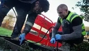 Technician conducting a CCTV drainage survey with advanced equipment